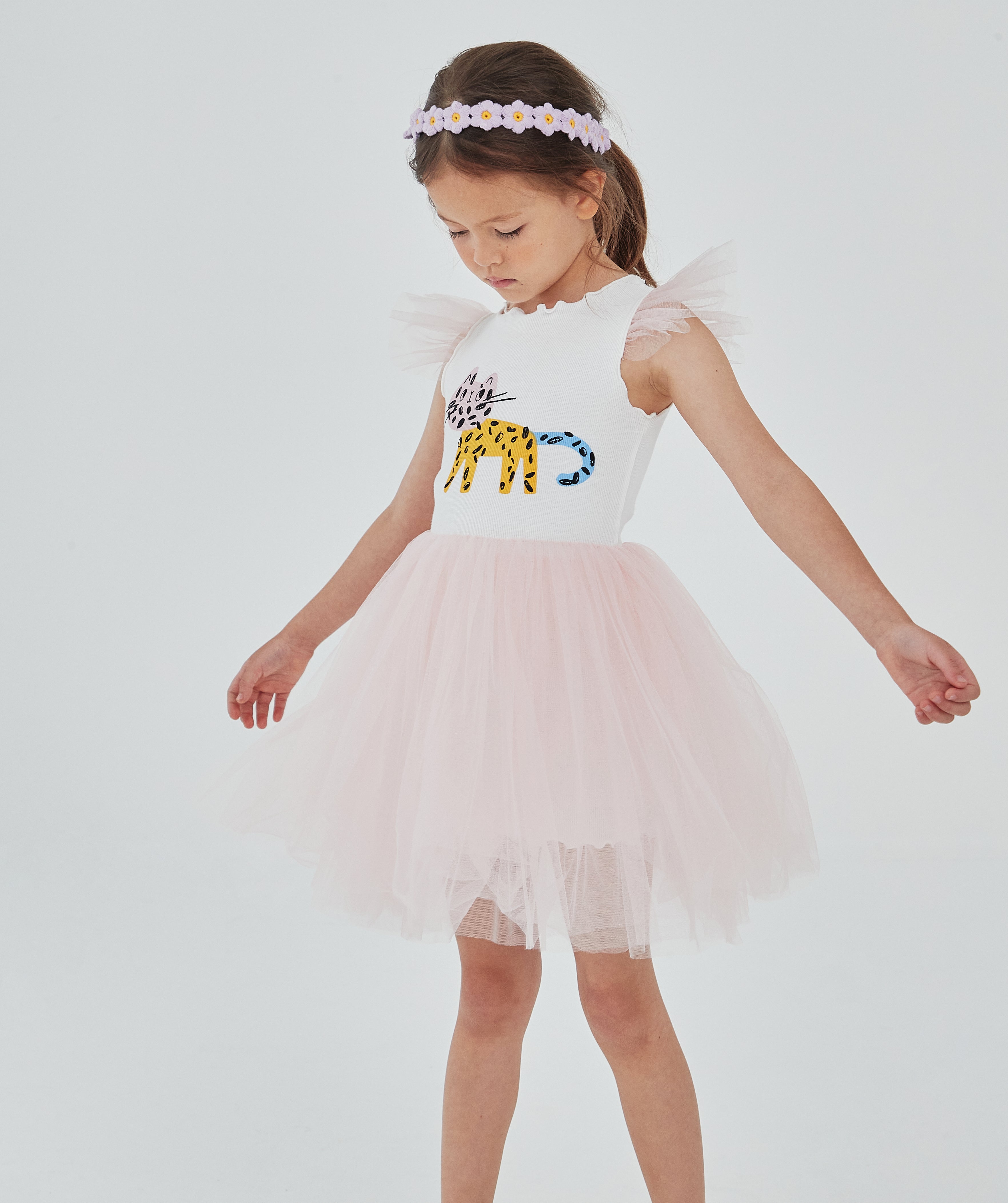 pink and white tutu dress with abstract multicolor cat print on the top front