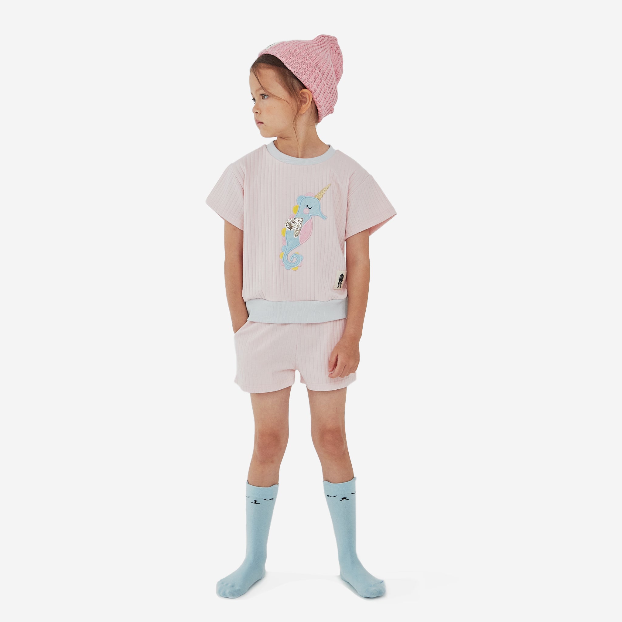 knitted pink hat with black ph play logo on white background
