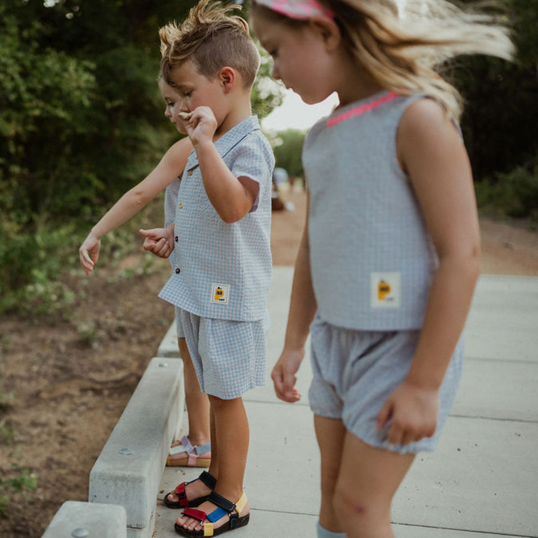 light blue checker set includes short sleeves top with buttons on the front and a short 