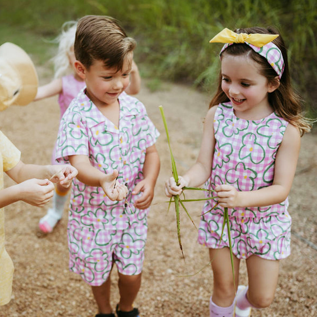 pink checker with green flowers set includes short sleeves top with buttons on the front and a short 