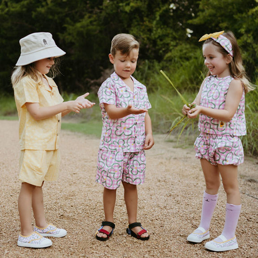 pink checker with green flowers set includes short sleeves top with buttons on the front and a short 