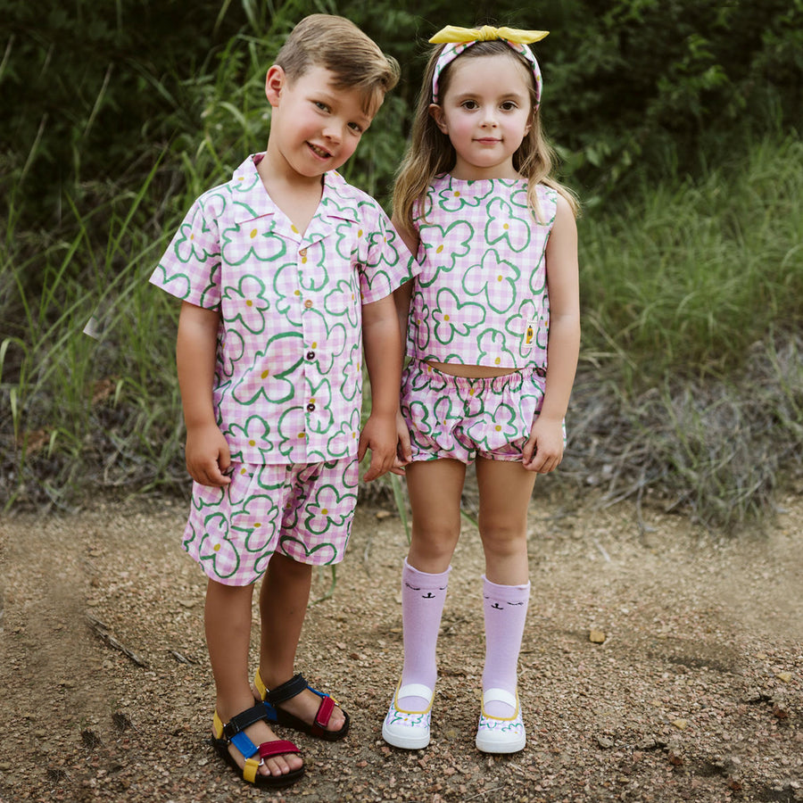 pink checker with green flowers set includes short sleeves top with buttons on the front and a short 