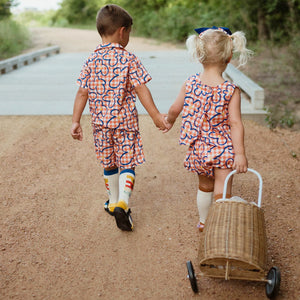 orange checker with blue flowers set includes short sleeves top with buttons on the front and a short 