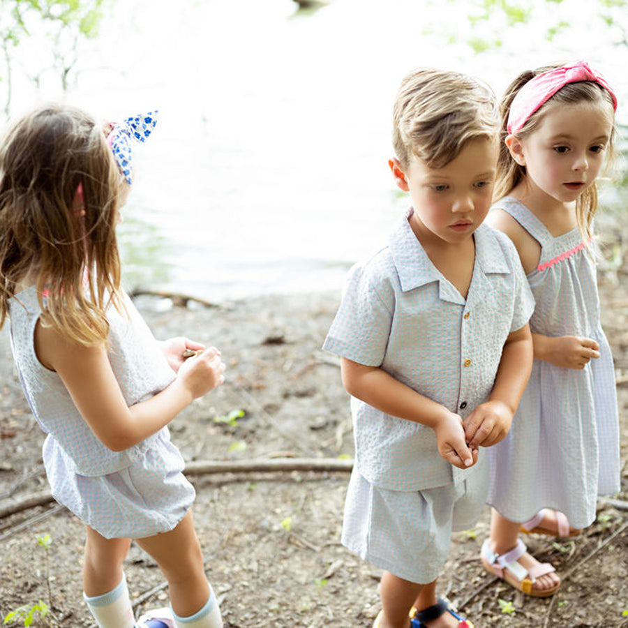 light blue checker set includes short sleeves top with buttons on the front and a short 