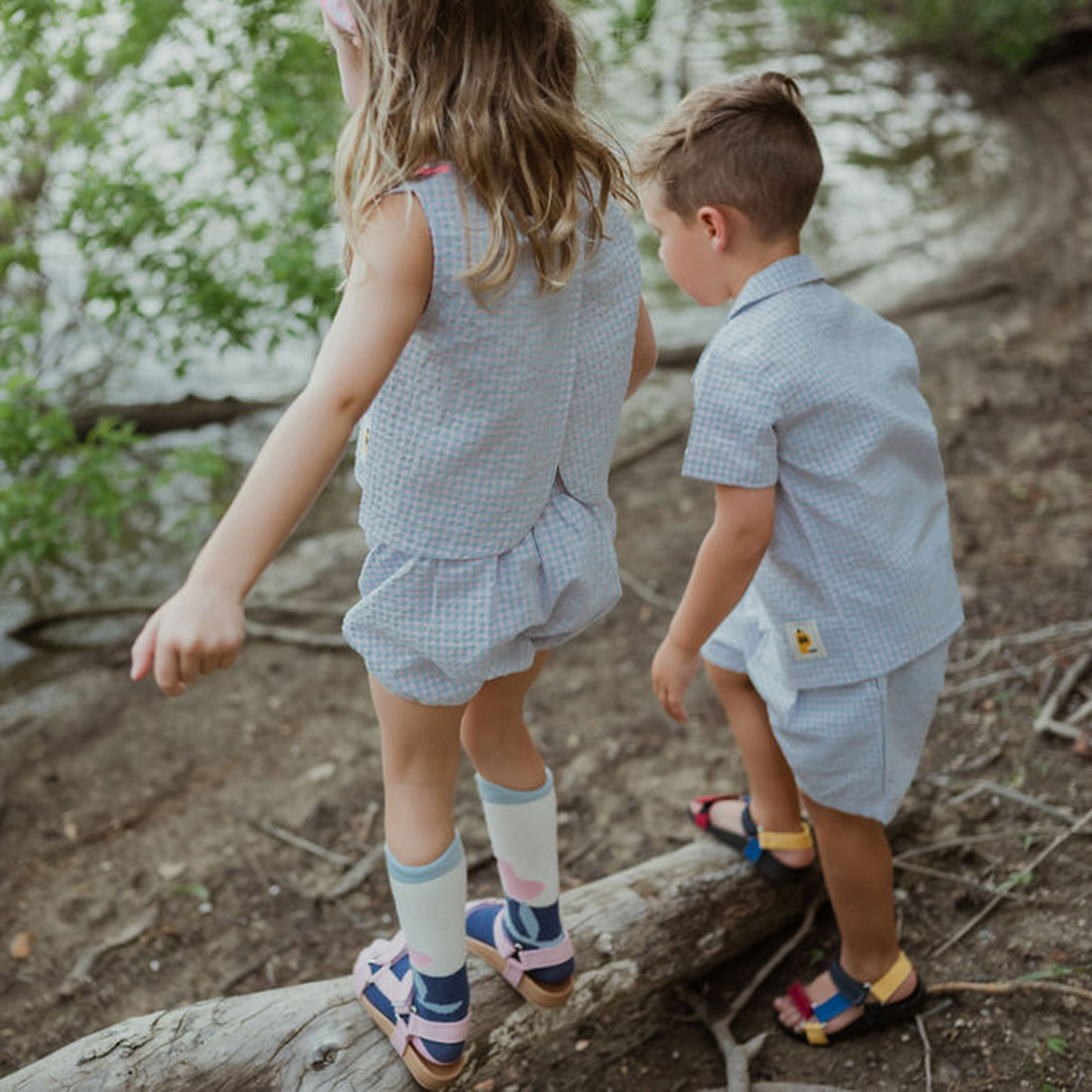 light blue checker set includes short sleeves top with buttons on the front and a short 