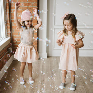 pink skirt with very tiny gold star and lines