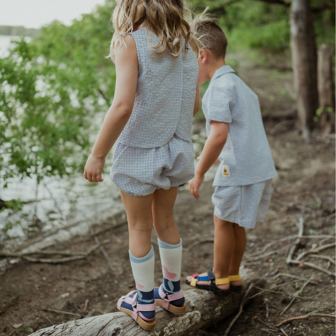 light blue checker set includes short sleeves top with buttons on the front and a short 