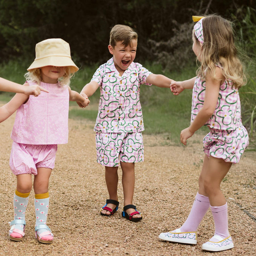 pink checker with green flowers set includes short sleeves top with buttons on the front and a short 