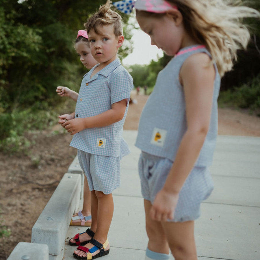 light blue checker set includes short sleeves top with buttons on the front and a short 