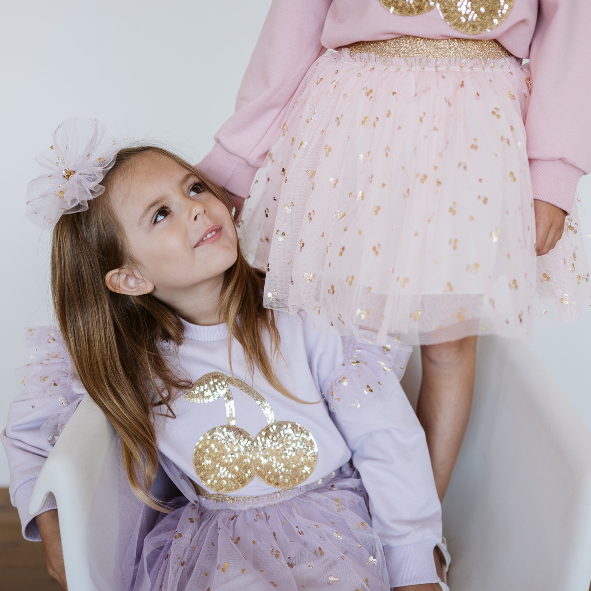 KIDS HIGH LOW HEM SKIRT 4-10 LUCKY CHARMS