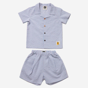 light blue checker set includes short sleeves top with buttons on the front and a short 