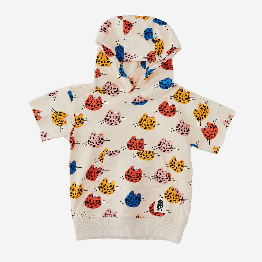 The Multi Cat short sleeves Print Hoodie has a cream background with Multi color abstract cat faces. The hoodie has an attached hat and kangaroo pocket.