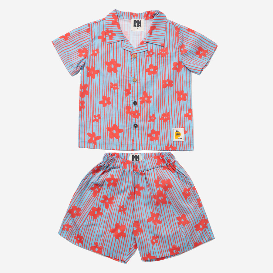 blue background with red flowers set includes short sleeves top with buttons on the front and a short 