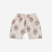 The Hedgehog print boy short has a light peach background with abstract hedgehog faces with orange oval eye glasses.